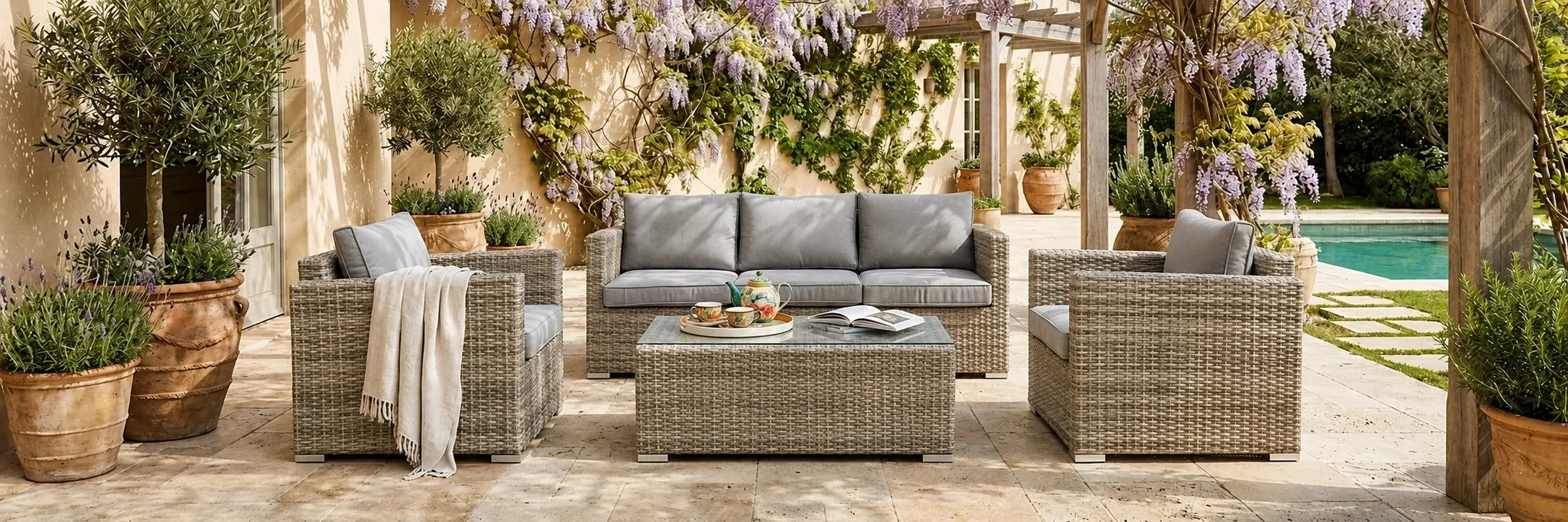 Wicker outdoor sofa setting on a paved terrace